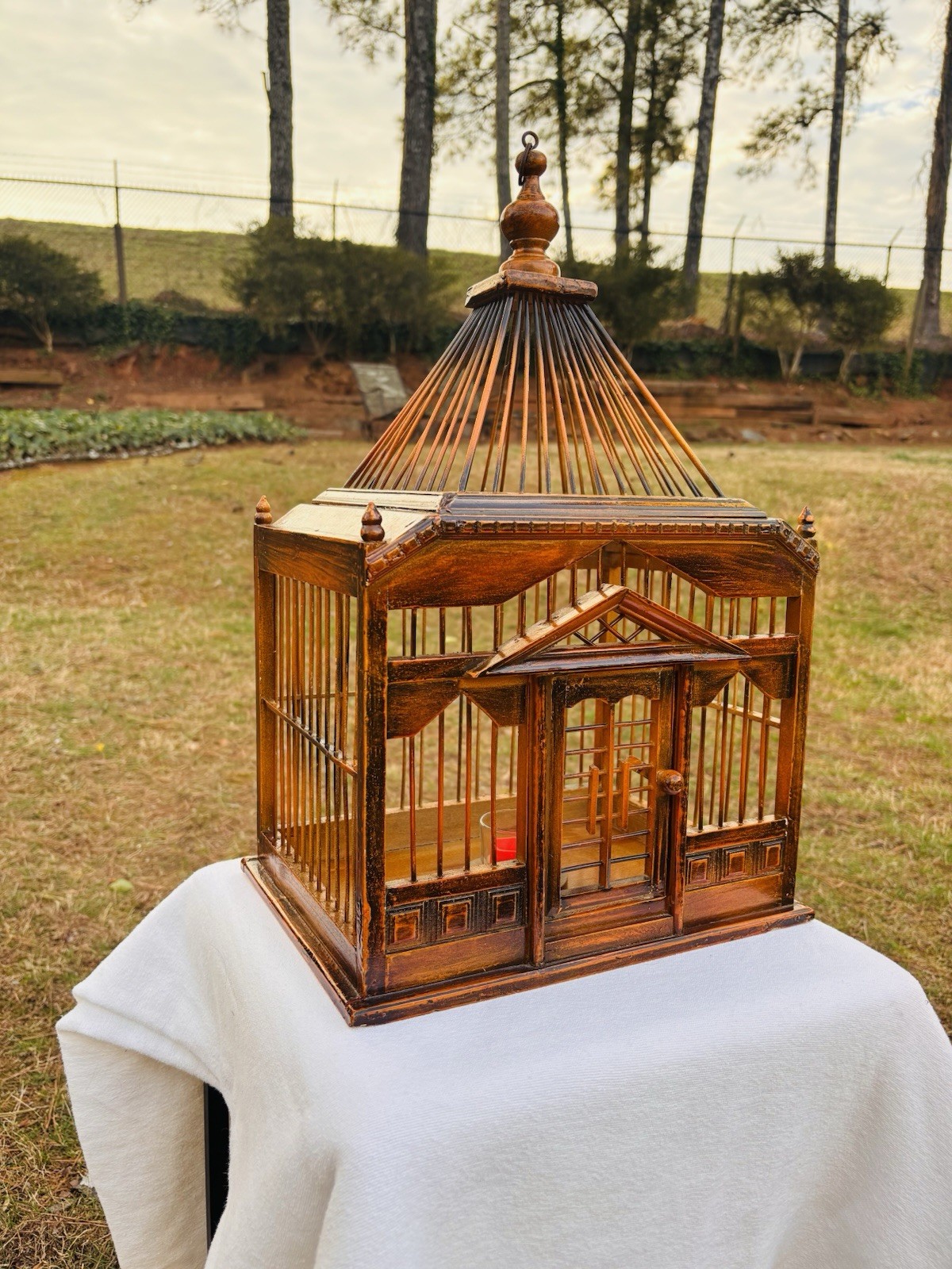 Wood Birdhouse with a pagoda-style top and intricate architectural details