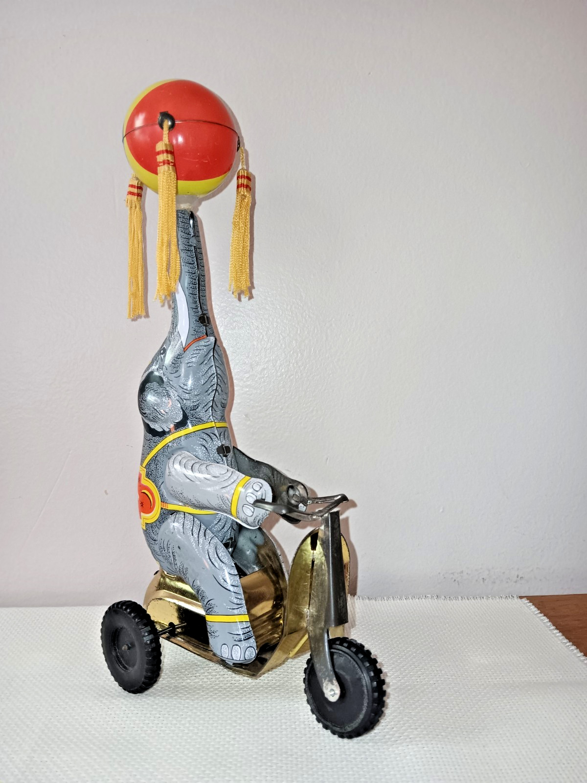 Tin Toy Elephant on Trike With Ball on Nose, 9 Inches Tall