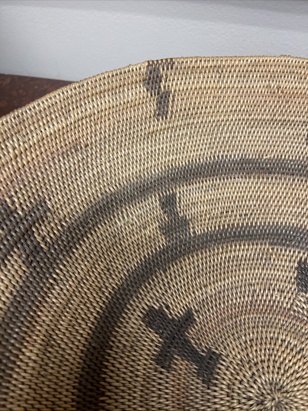 Woven Apache pictorial 17 1/4” basket with geometric and symbolic designs.