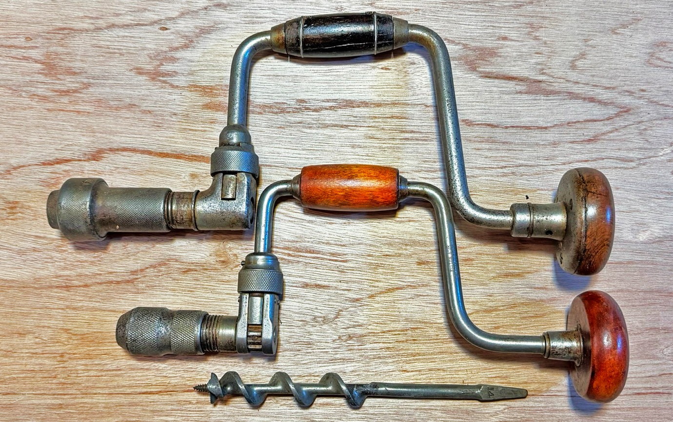 Vintage two Bit and Brace drills with a 1-inch auger bit