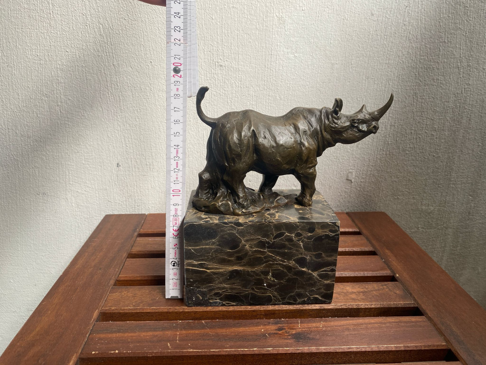 Bronze sculpture Walking Rhinoceros on a black marble base after Milo