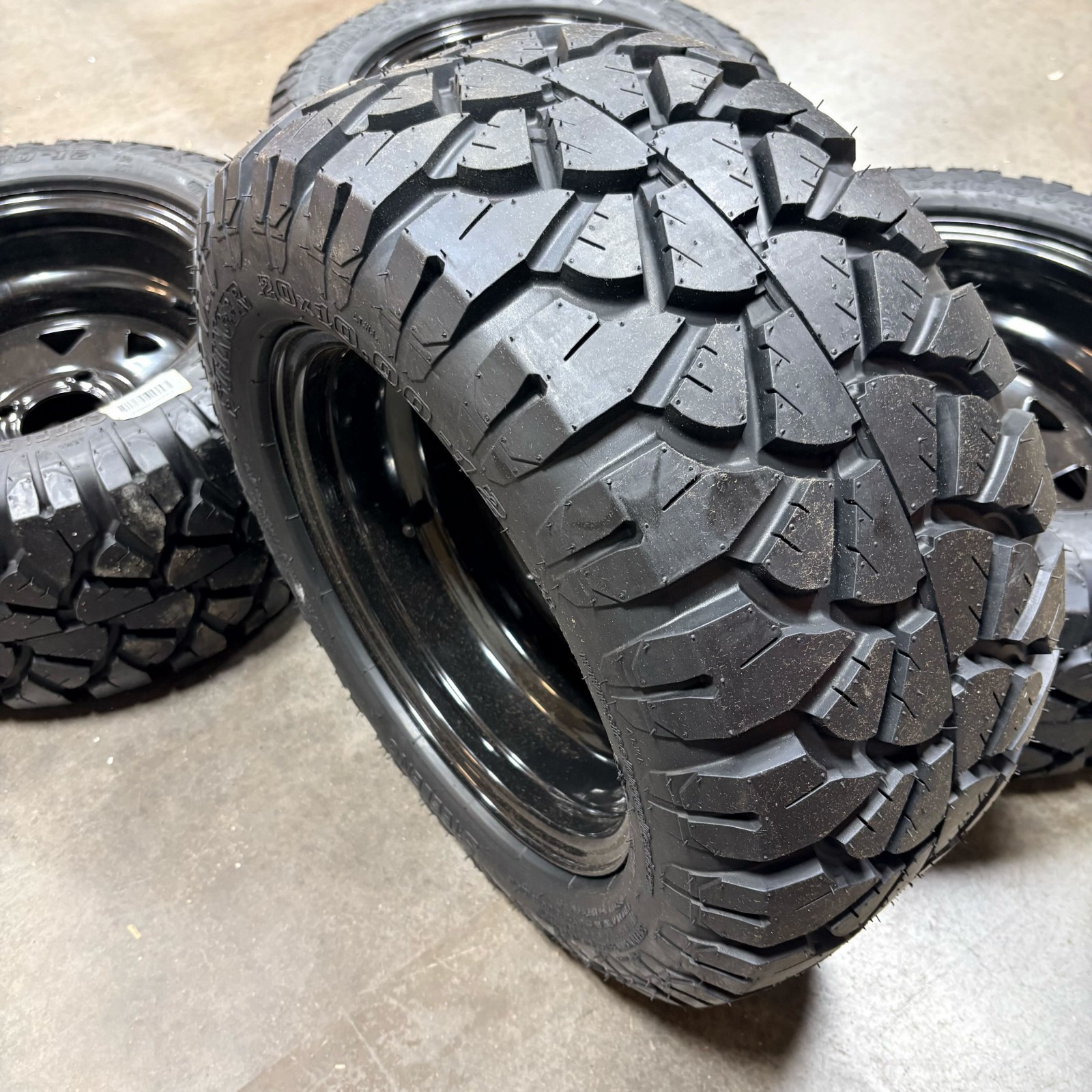 12" Black Steel Wheel & 20x10-12" Stinger All Terrain DOT Tire - Set of 4 (USED)