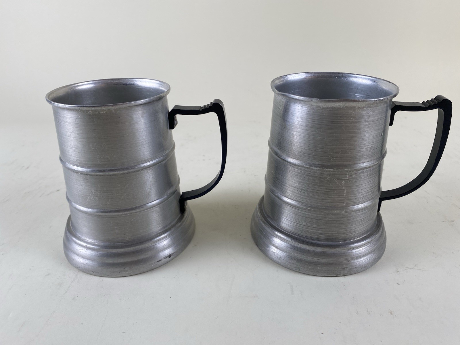 Pair Apex Aluminum Pewter Beer Steins Mugs w Glass Bottom Black Handle Hong Kong