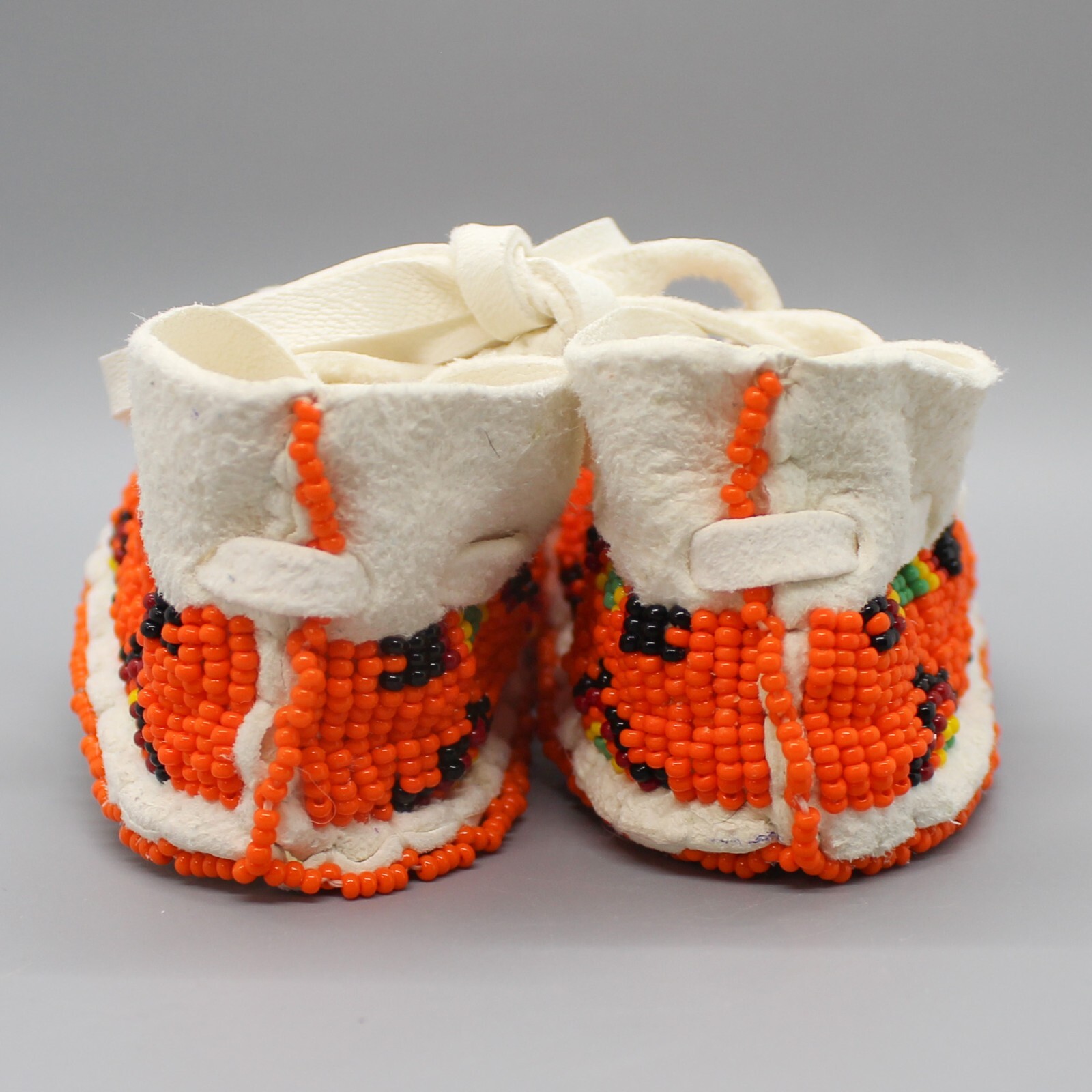 CHEYENNE-FULLY BEADED WHITE LEATHER BABY MOCCASINS by JANET WHITEMAN