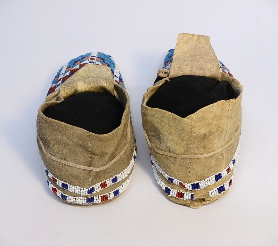 Antique Sioux Moccasins, painted parfleche interior soles