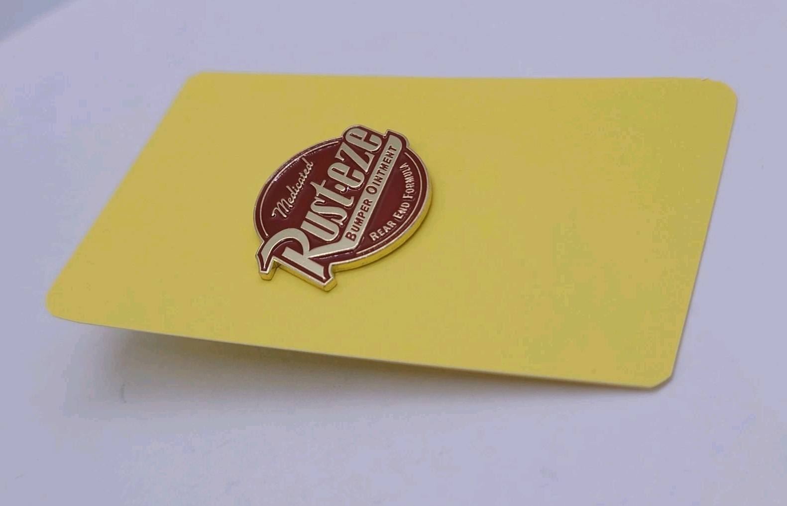 Rusteze Medicated Bumper Ointment Logo Round Enamel Pin – Rear End Formula Cars