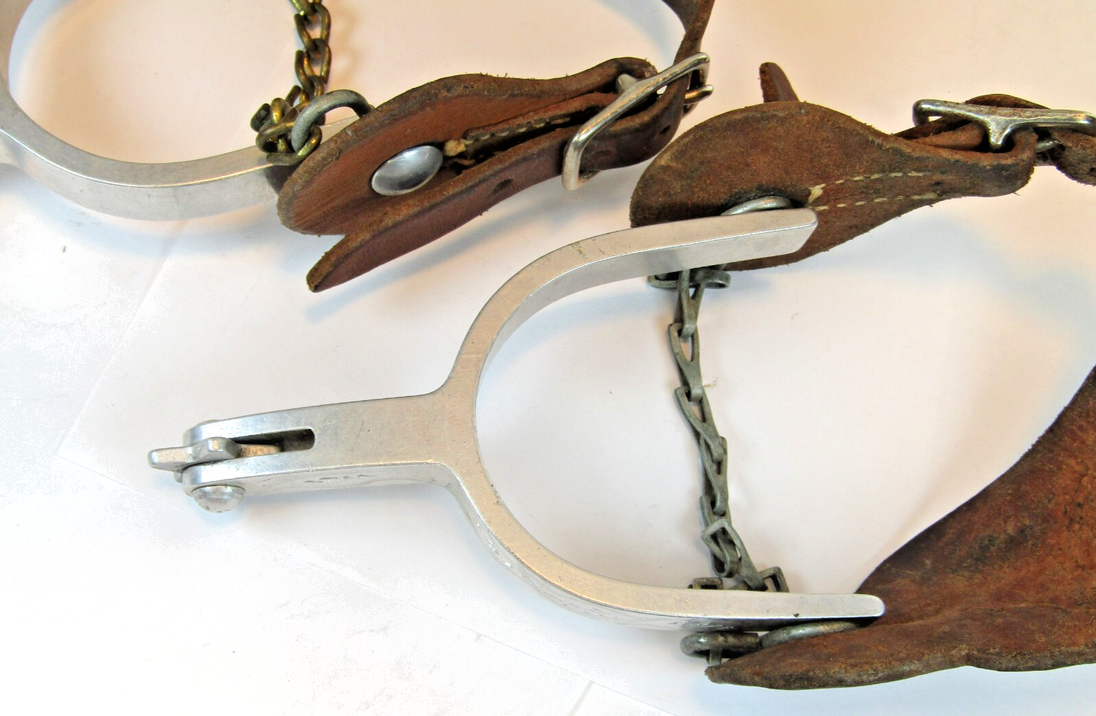 PAIR OF UNMARKED ENGRAVED ALUMINUM AIRPLANE METAL RIDING SPURS W/ STRAPS