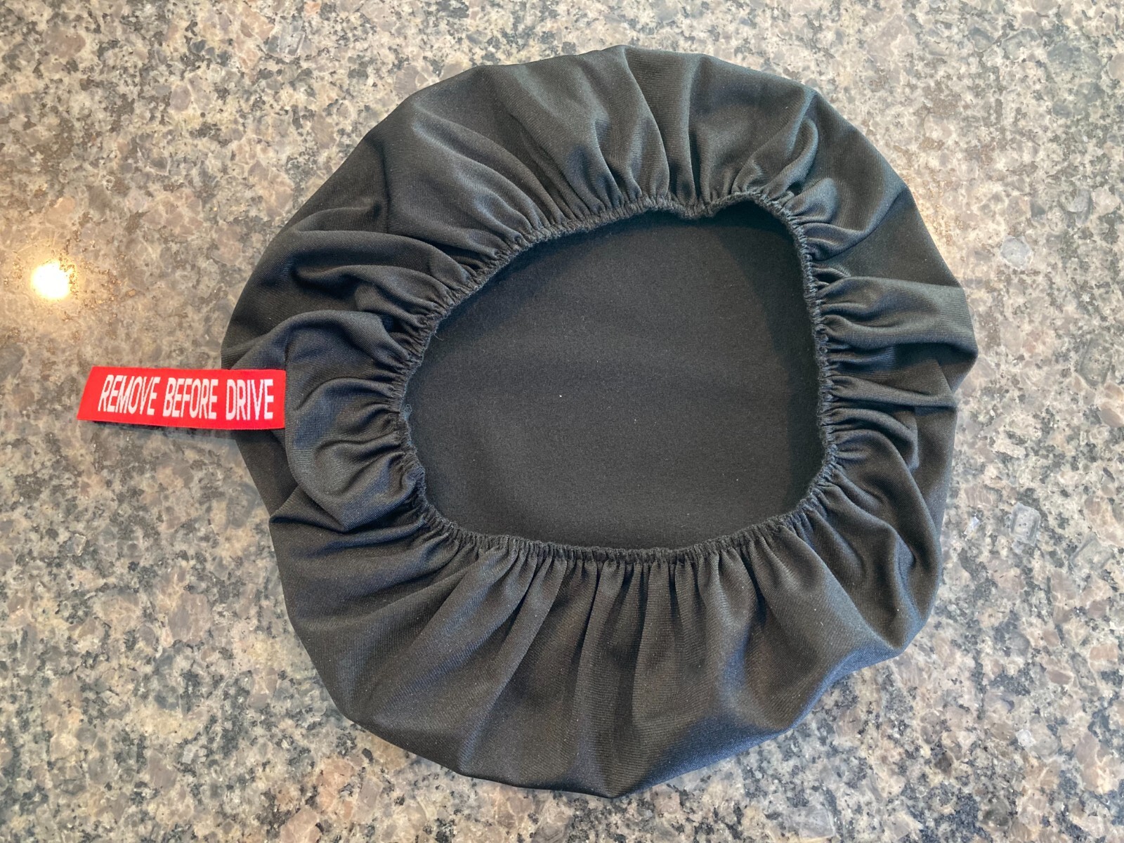 PORSCHE DESIGN OEM FACTORY STEERING WHEEL PROTECTIVE COVER IN BLACK W/CREST. NEW