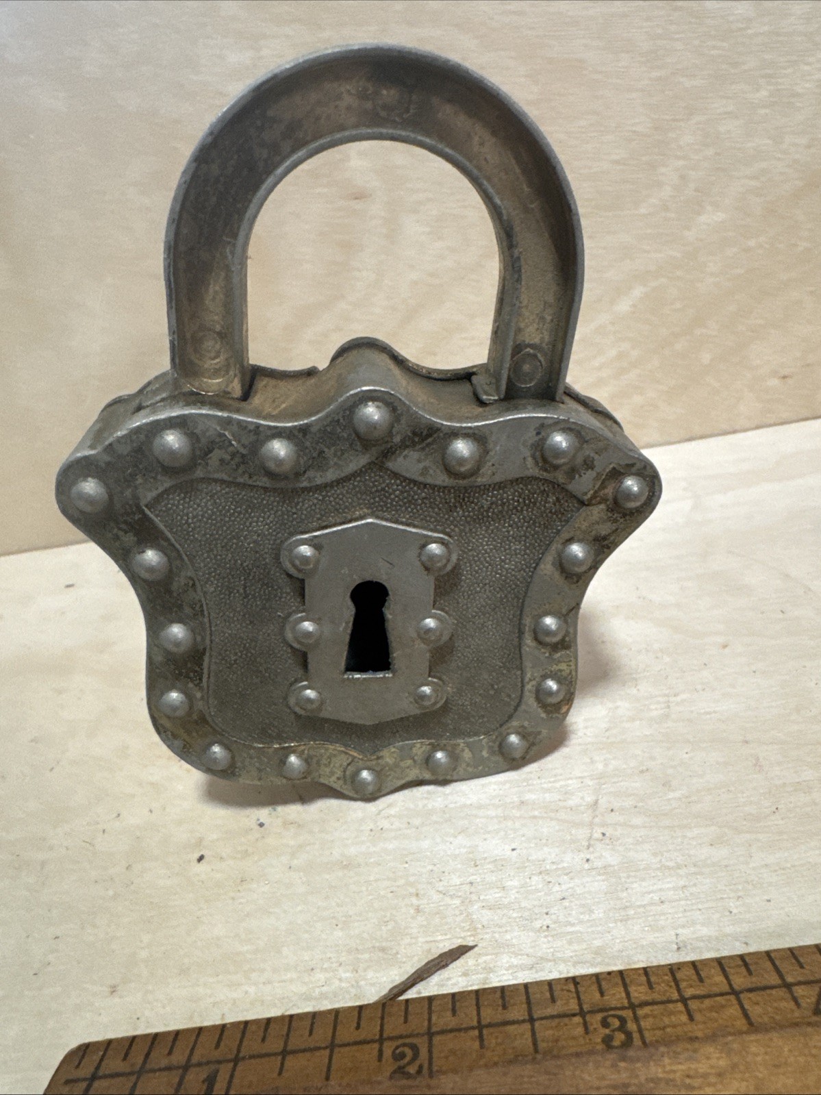 vintage Hubley Padlock Cap, a unique toy from the mid-20th century