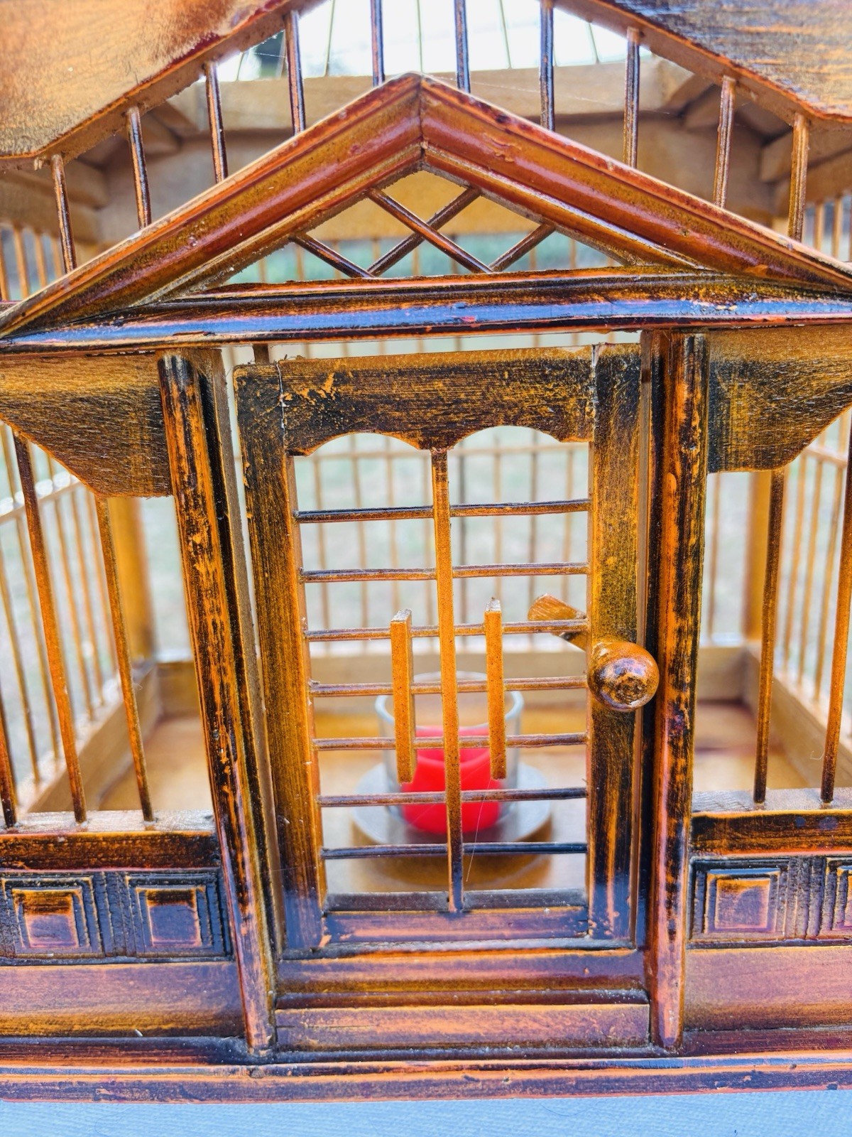 Wood Birdhouse with a pagoda-style top and intricate architectural details