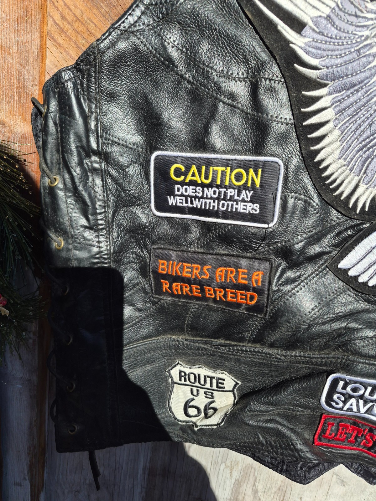 Vintage harley hog leather vest filled with pins and has patches 2xl