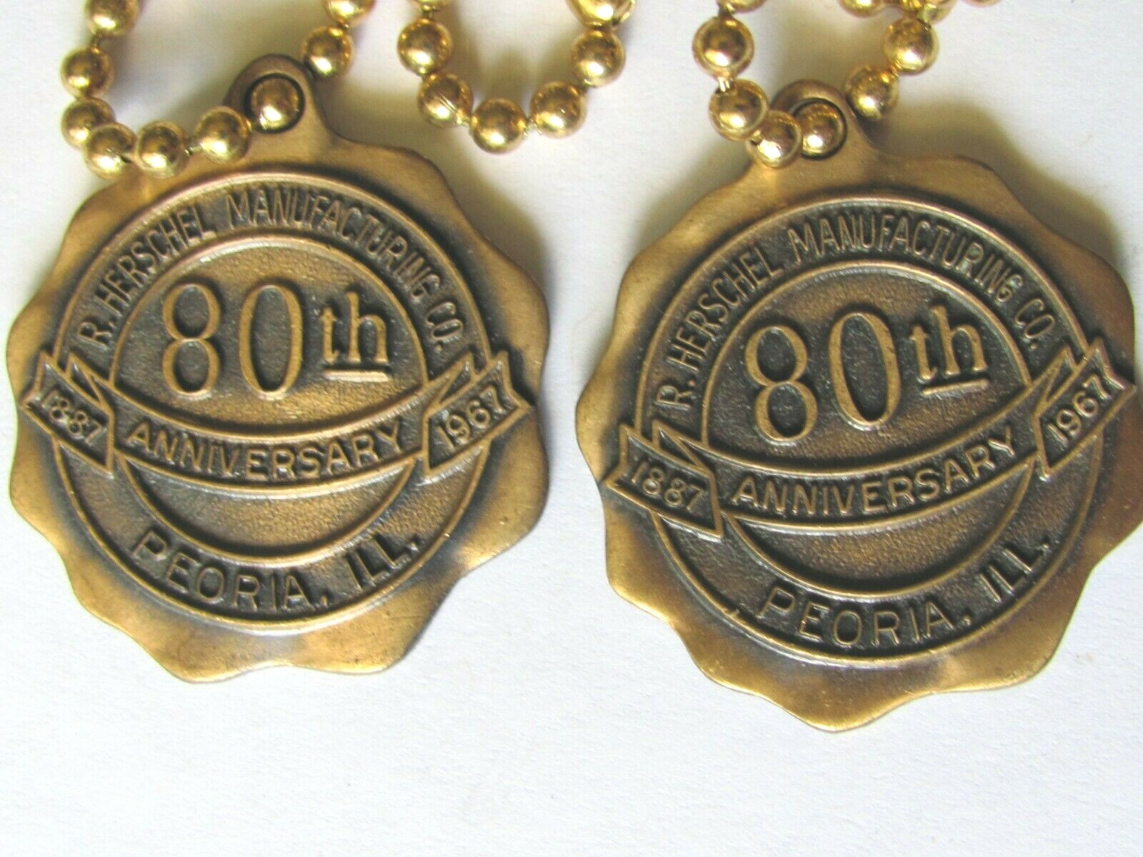 2 HERSCHEL MFG CO PEORIA IL 1967 80th ANNIVERSARY KEY CHAIN FOB FARM MOWER