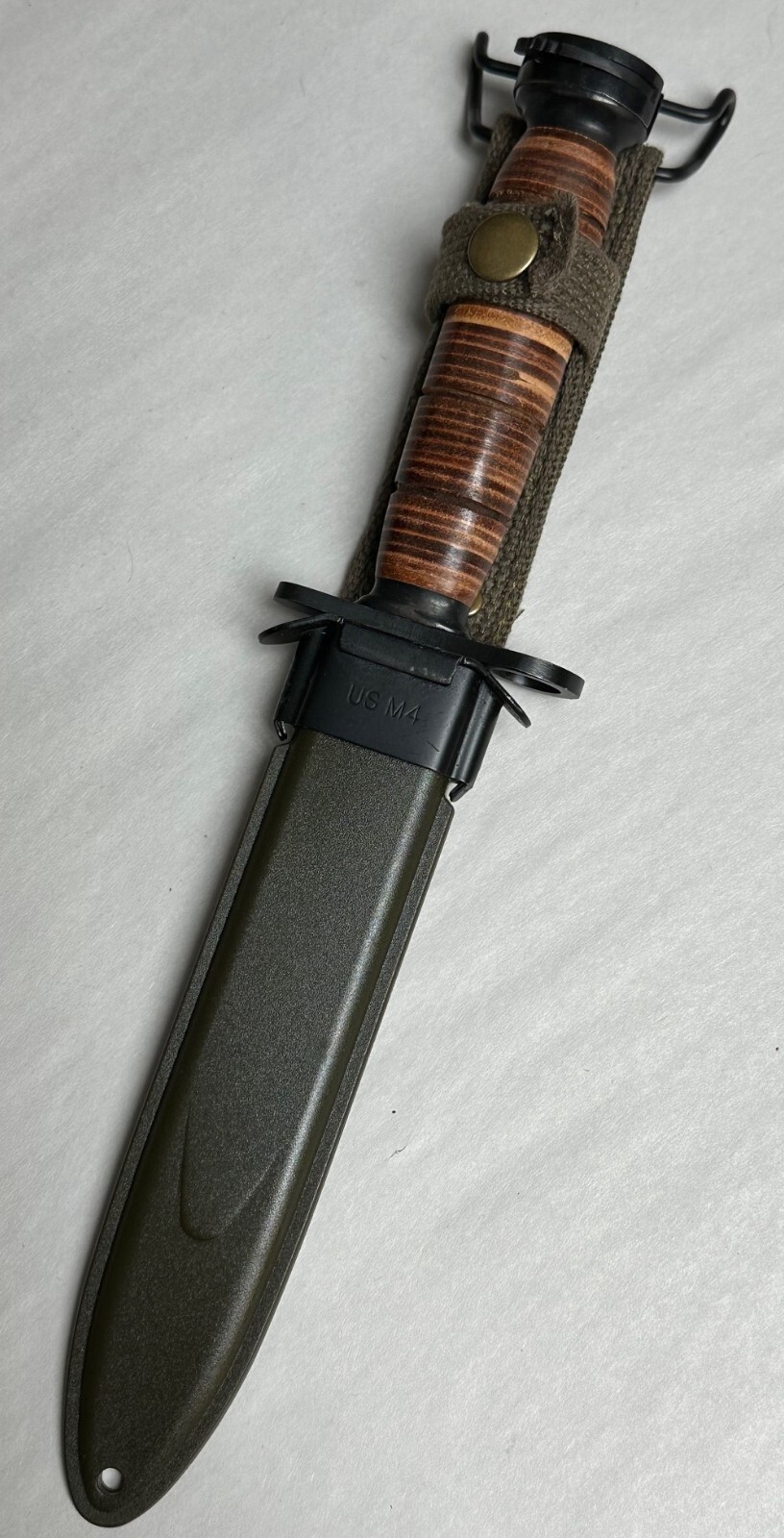 M1 CARBINE BAYONET LEATHER HANDLE WITH SCABBARD.