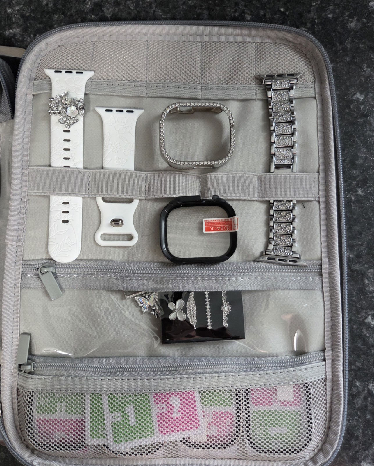 Travel Organizer Storage Case for (included) Smartwatch bands and accessories.