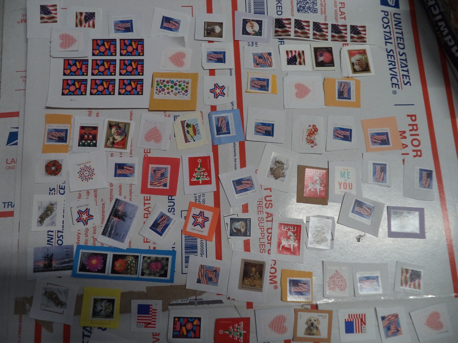 100 GENUINE FOREVER $73 US POSTAGE STAMPS NOT USED AS INTENDED PURPOSE ON PAPER