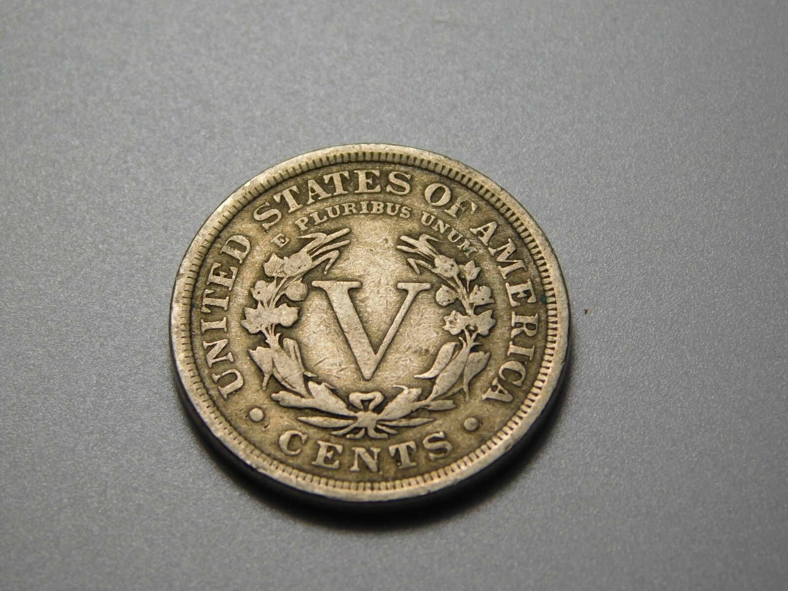 US COIN 1910 LIBERTY HEAD V NICKEL SLIGHTLY OFF CENTER