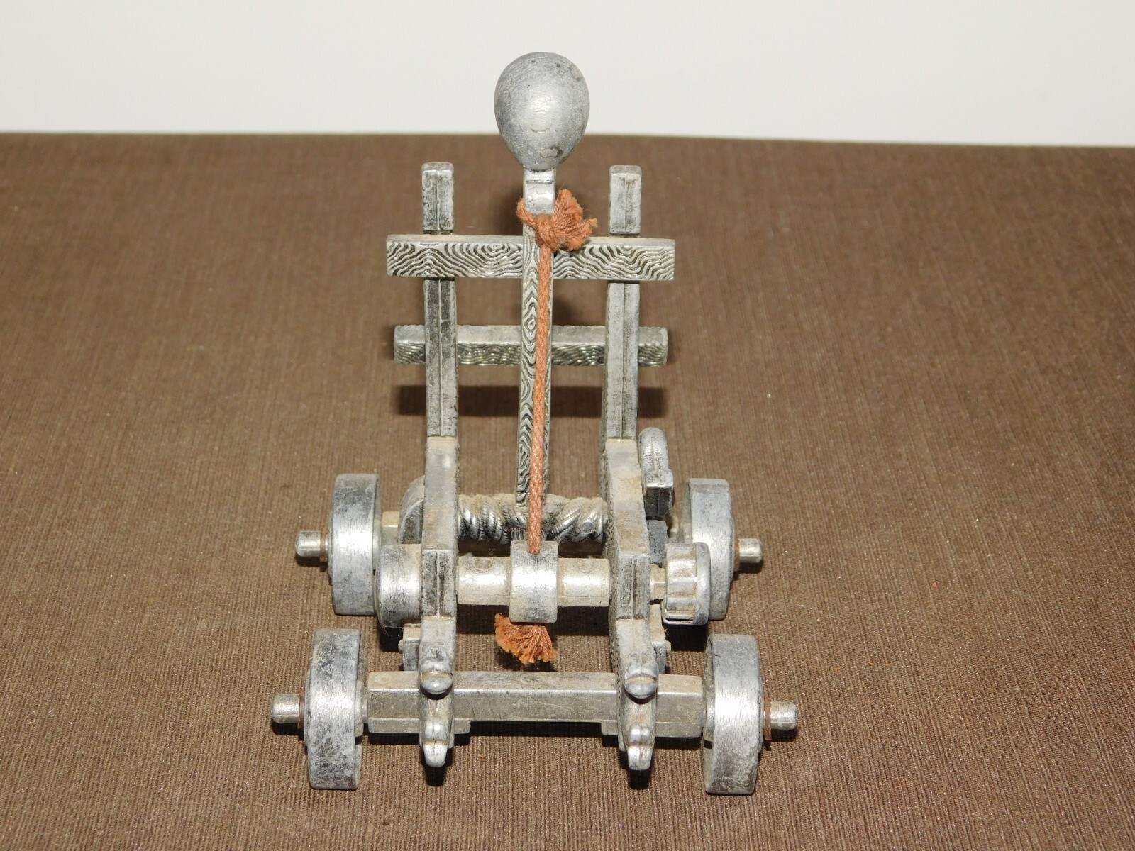 VINTAGE TOY 5" X 4" X 5 1/2" HIGH METAL CATAPULT