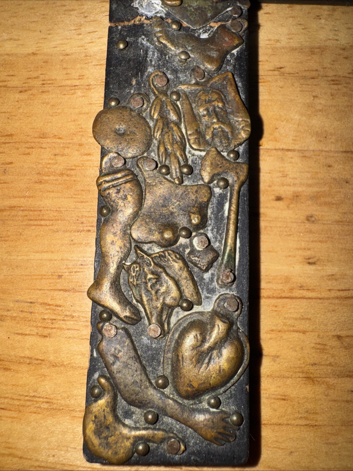 Vintage handmade folk art cross with 35+ brass milagros signed Gonzalez 1993