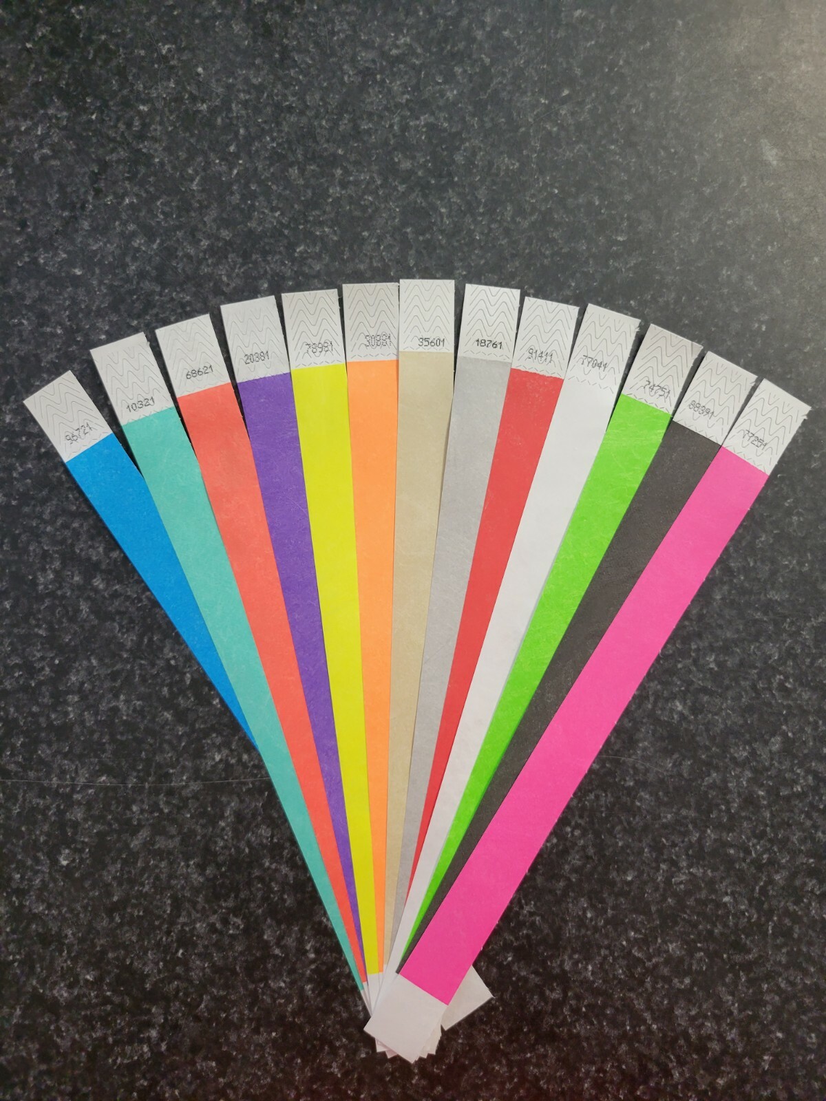 130 3/4" ASSORTED TYVEK WRISTBANDS, 10 EACH OF 13 COLORS. PAPER ARM BANDS