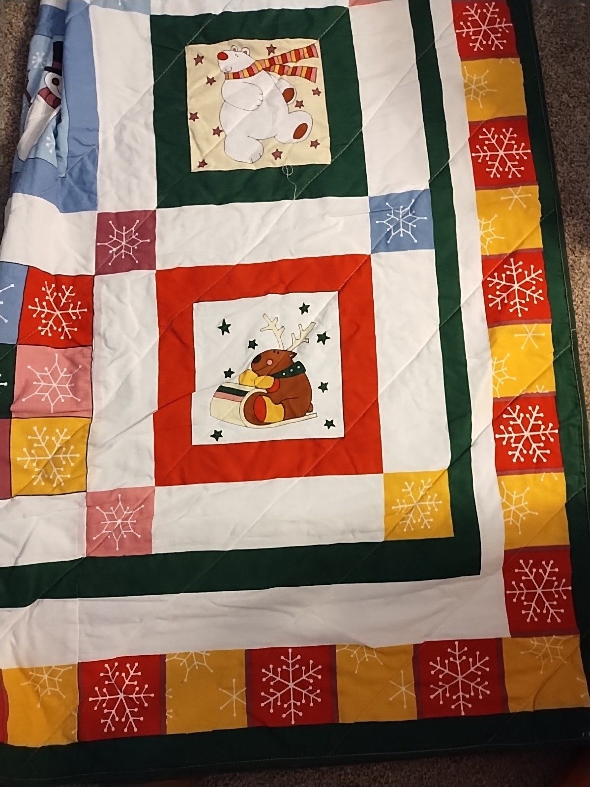 quilt featuring a winter scene with a snowman, reindeer, and penguin Q/F