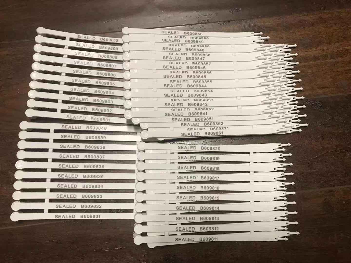 100 White plastic security seals numbered. Truck container seals 7.5 inch