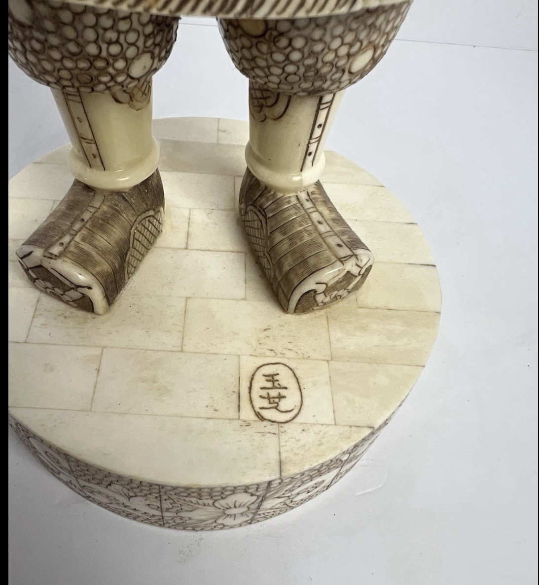 Japanese carved figure is a warrior.