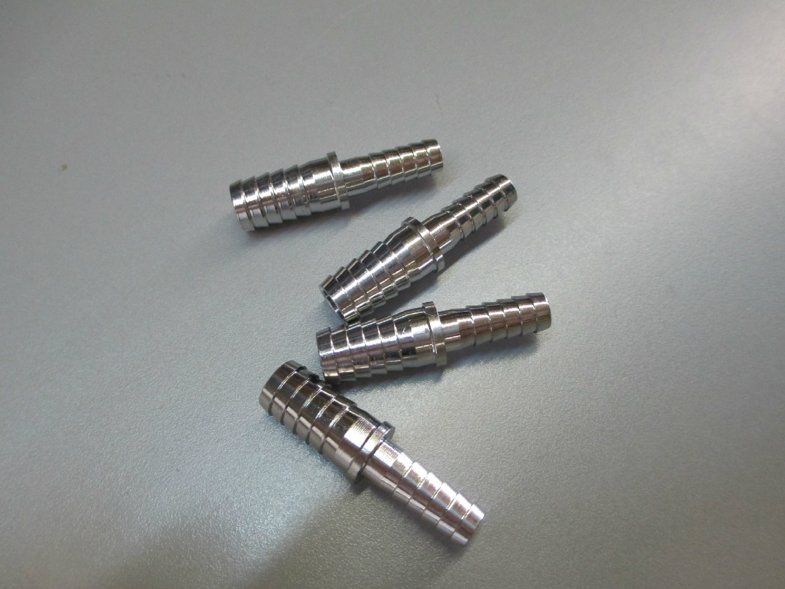 (4) 1/4"x 3/8" BARB SPLICERS. STAINLESS STEEL FITTINGS