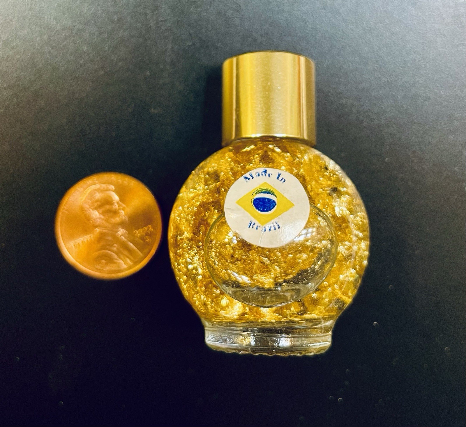Pure Gold Leaf Flakes in a Sealed Bottle