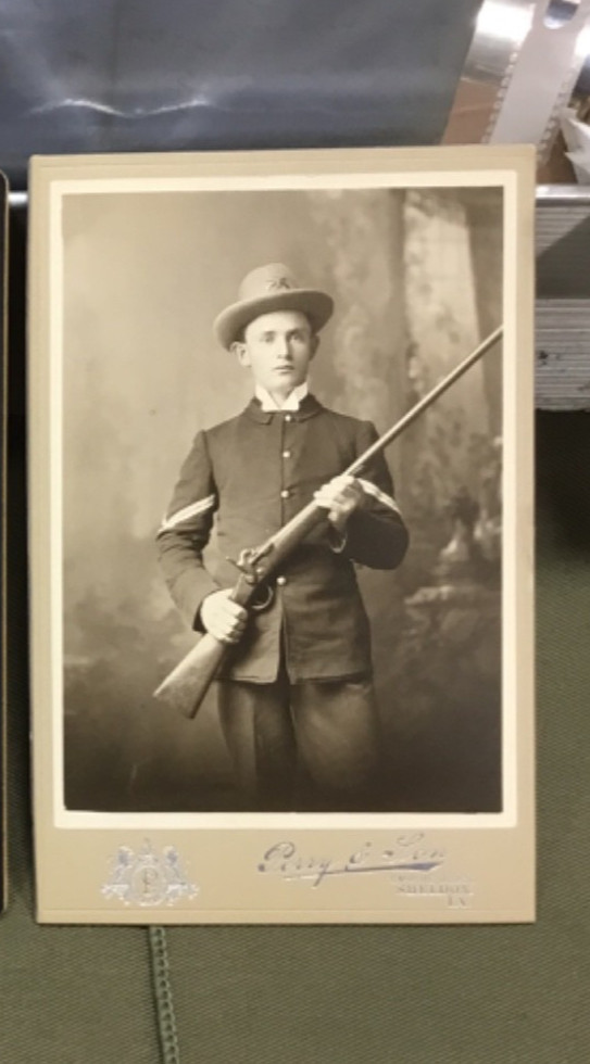Cabinet Photo - Iowa Soldier holding a Zulu shotgun
