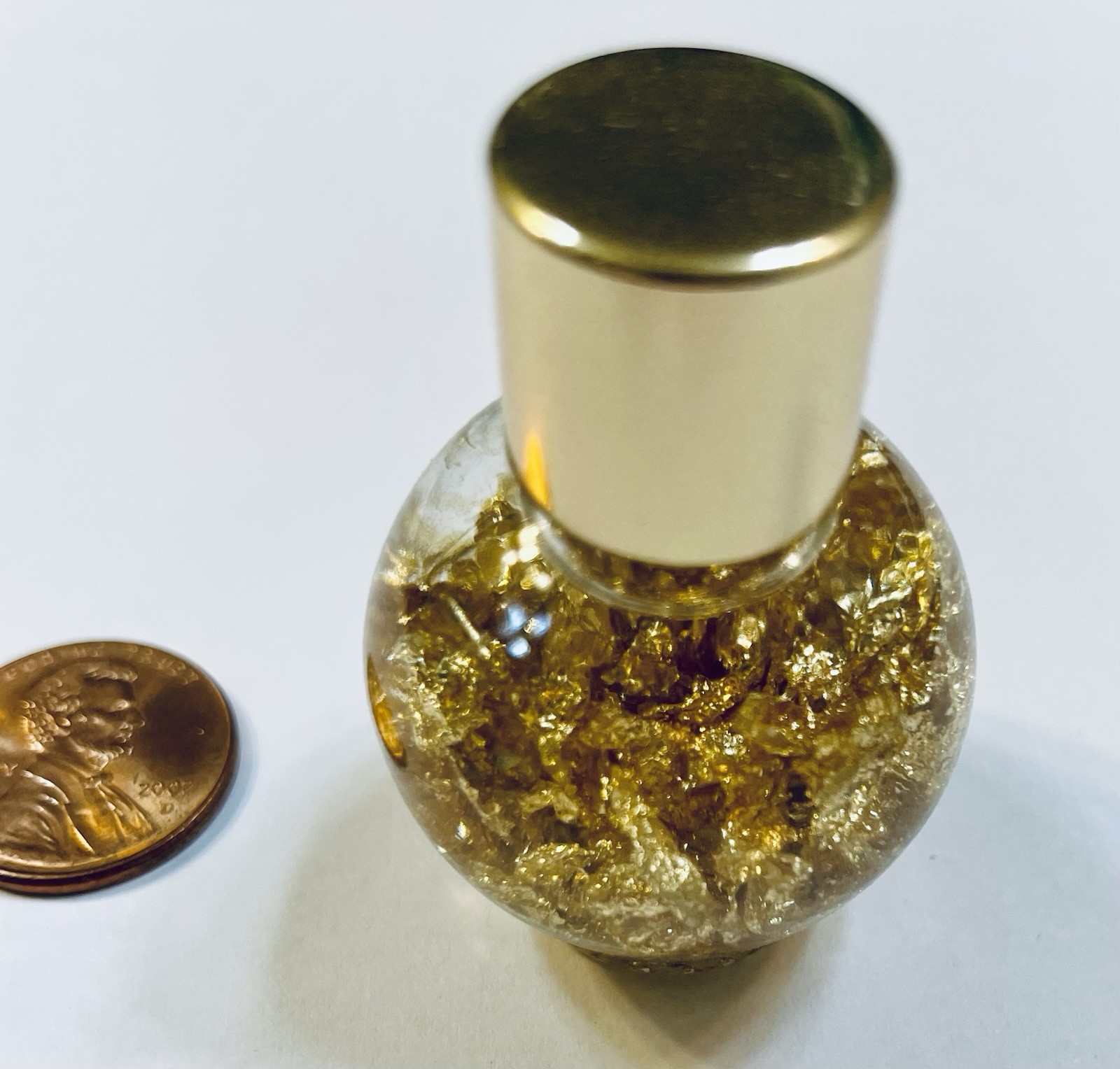 Pure Gold Leaf Flakes in a Sealed Bottle
