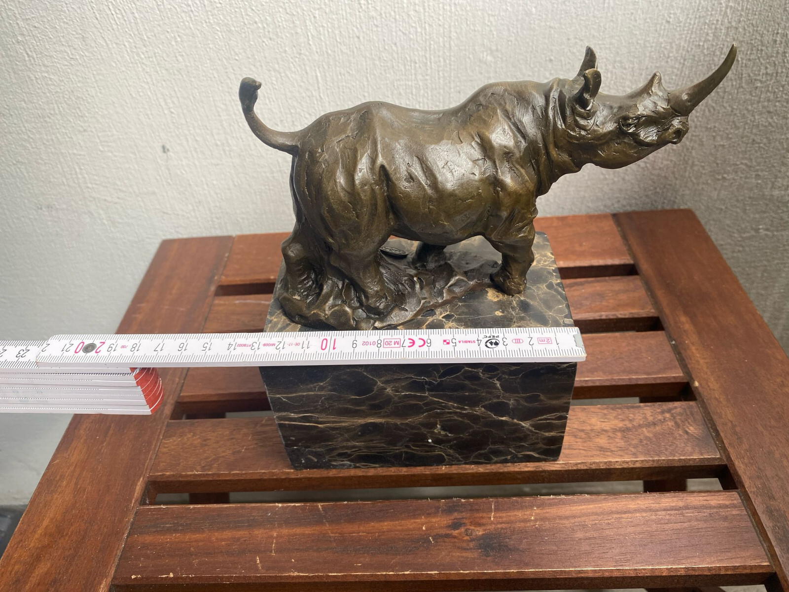 Bronze sculpture Walking Rhinoceros on a black marble base after Milo