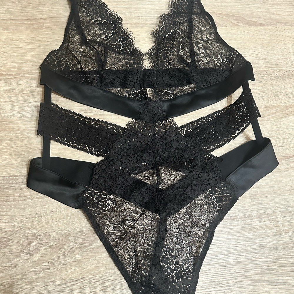 Victorias Secret Black Lace Thong Bodysuit. Size large.