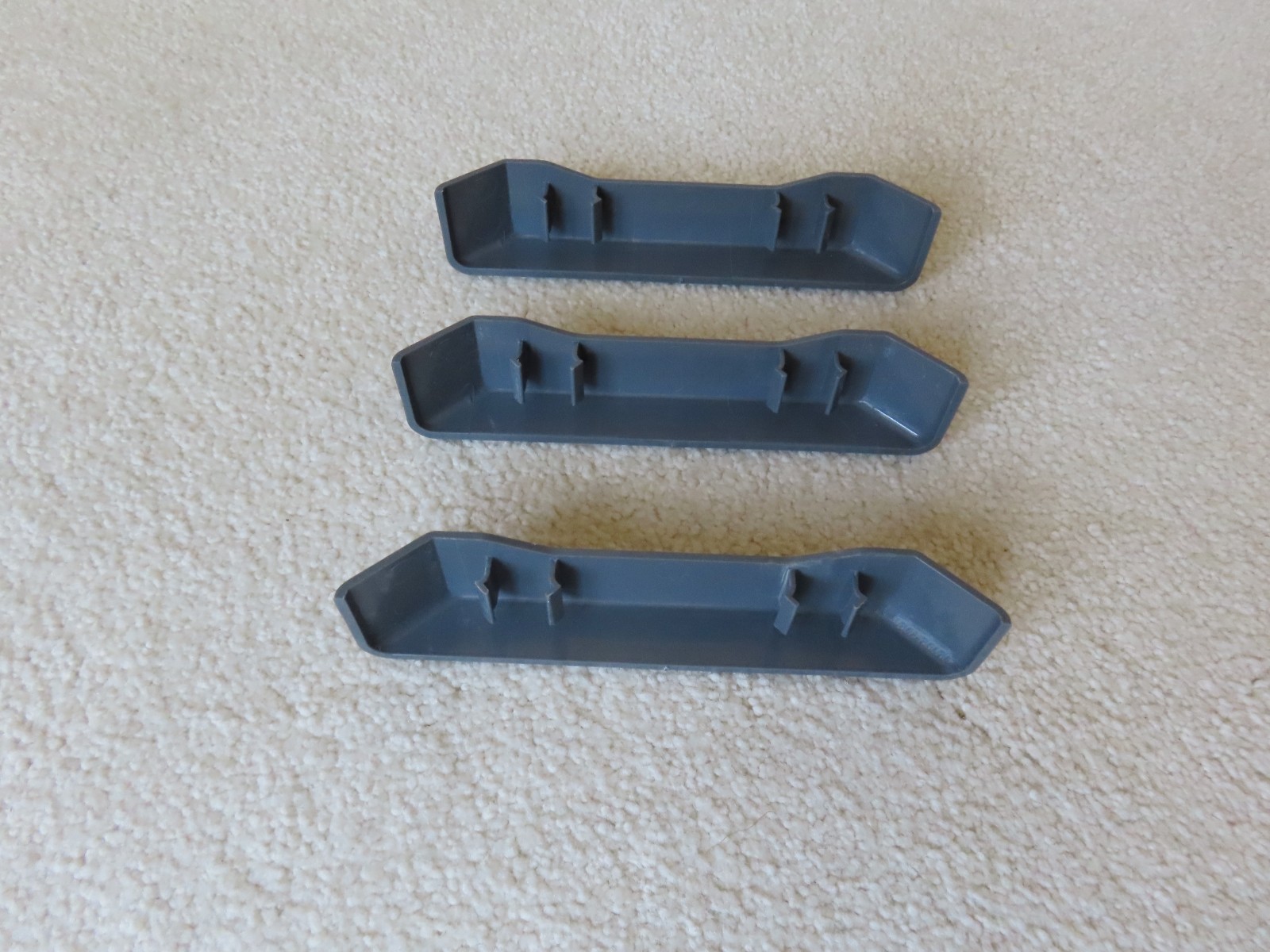 Open Box with Three (3) Individual Gladiator GearTrack Slide On End Caps