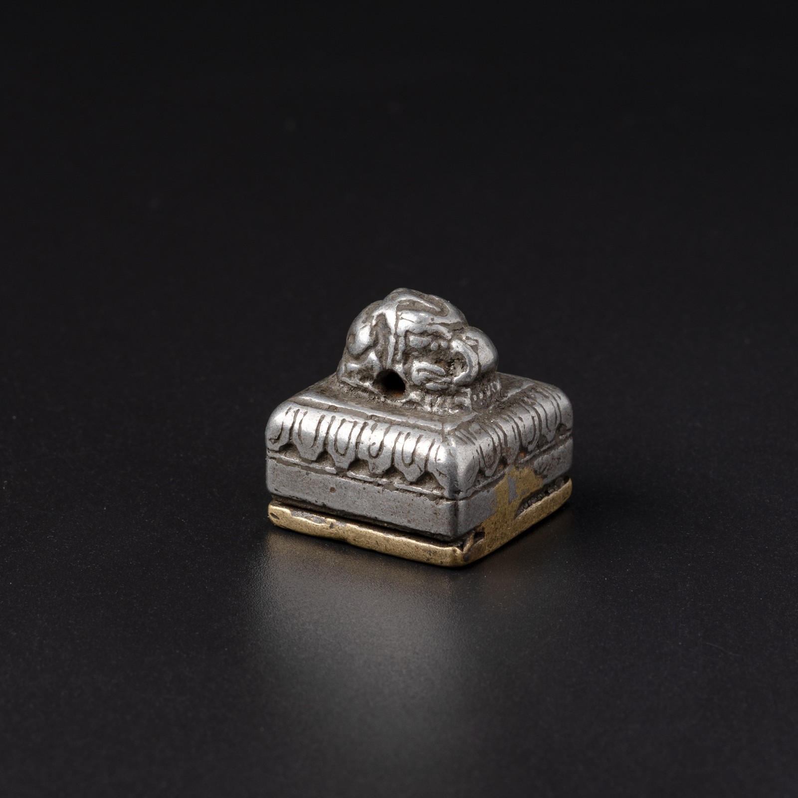 Tibetan Bronze and Iron Seal with Conch Motif