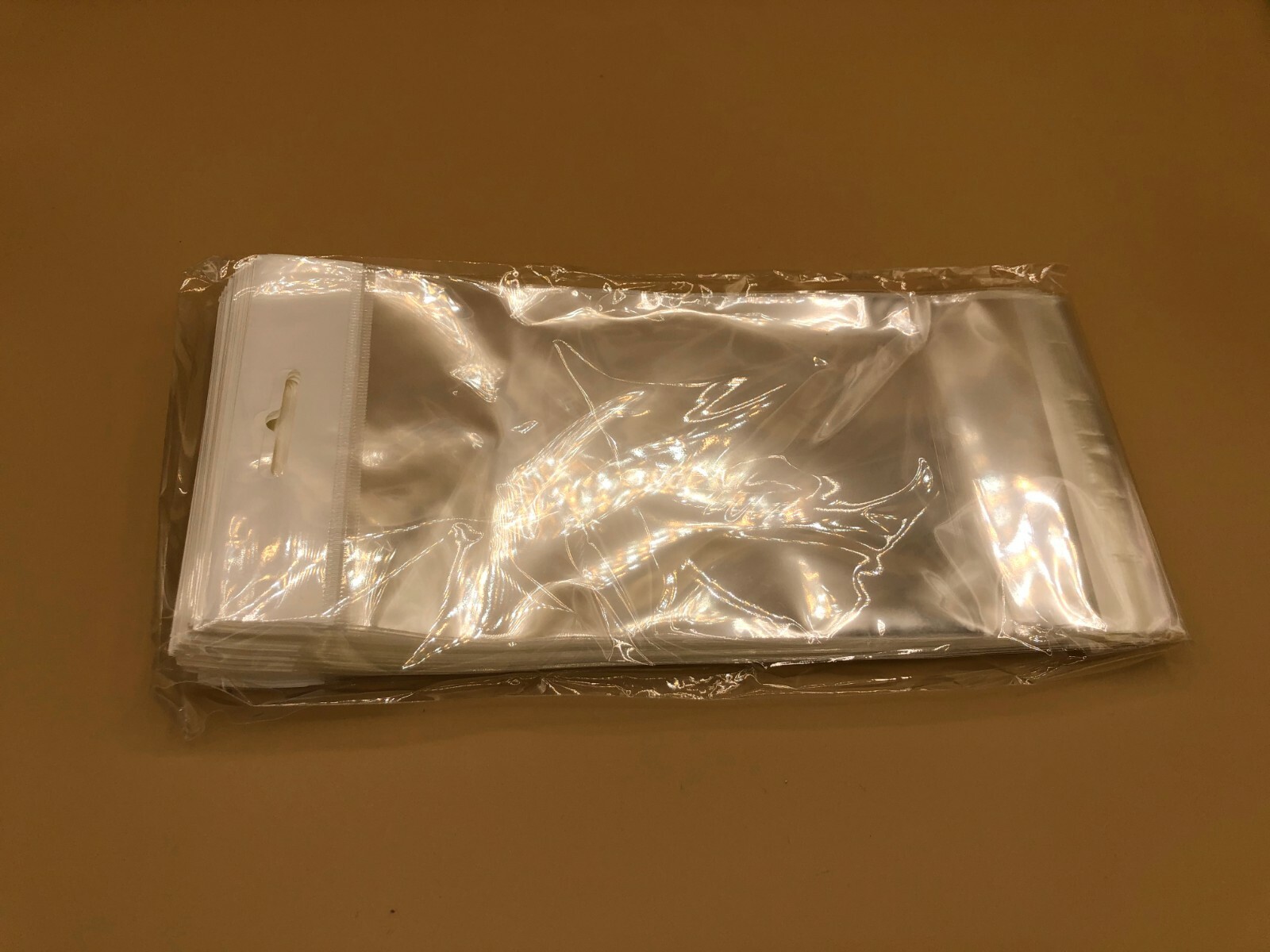 100 Clear Cello Bags HANG TOP, Resealable Self Adhesive OPP Poly Hang Hole bag