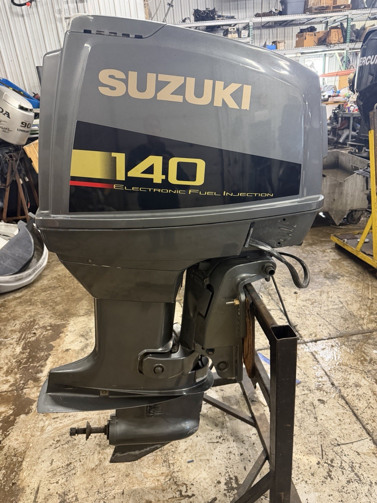 1999 Suzuki DT 140 EFI two stroke oil injected 20" long shaft remote freshwater