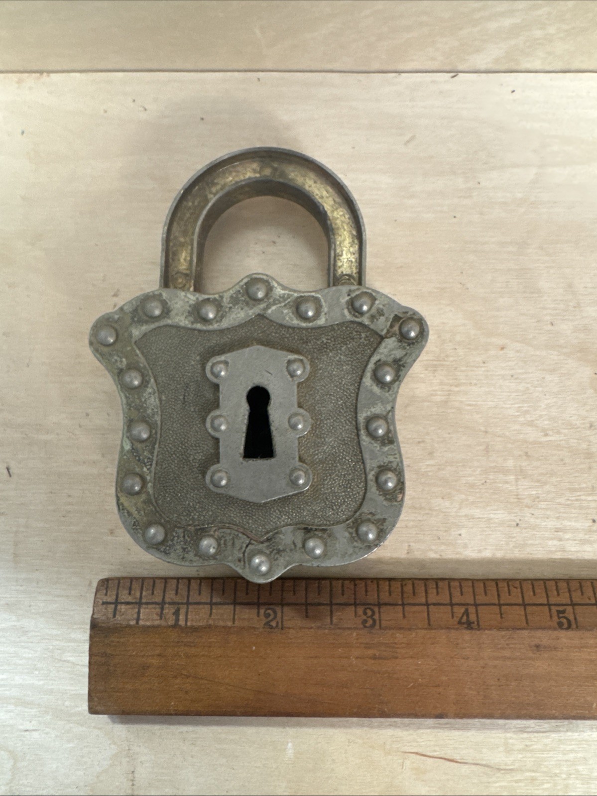 vintage Hubley Padlock Cap, a unique toy from the mid-20th century