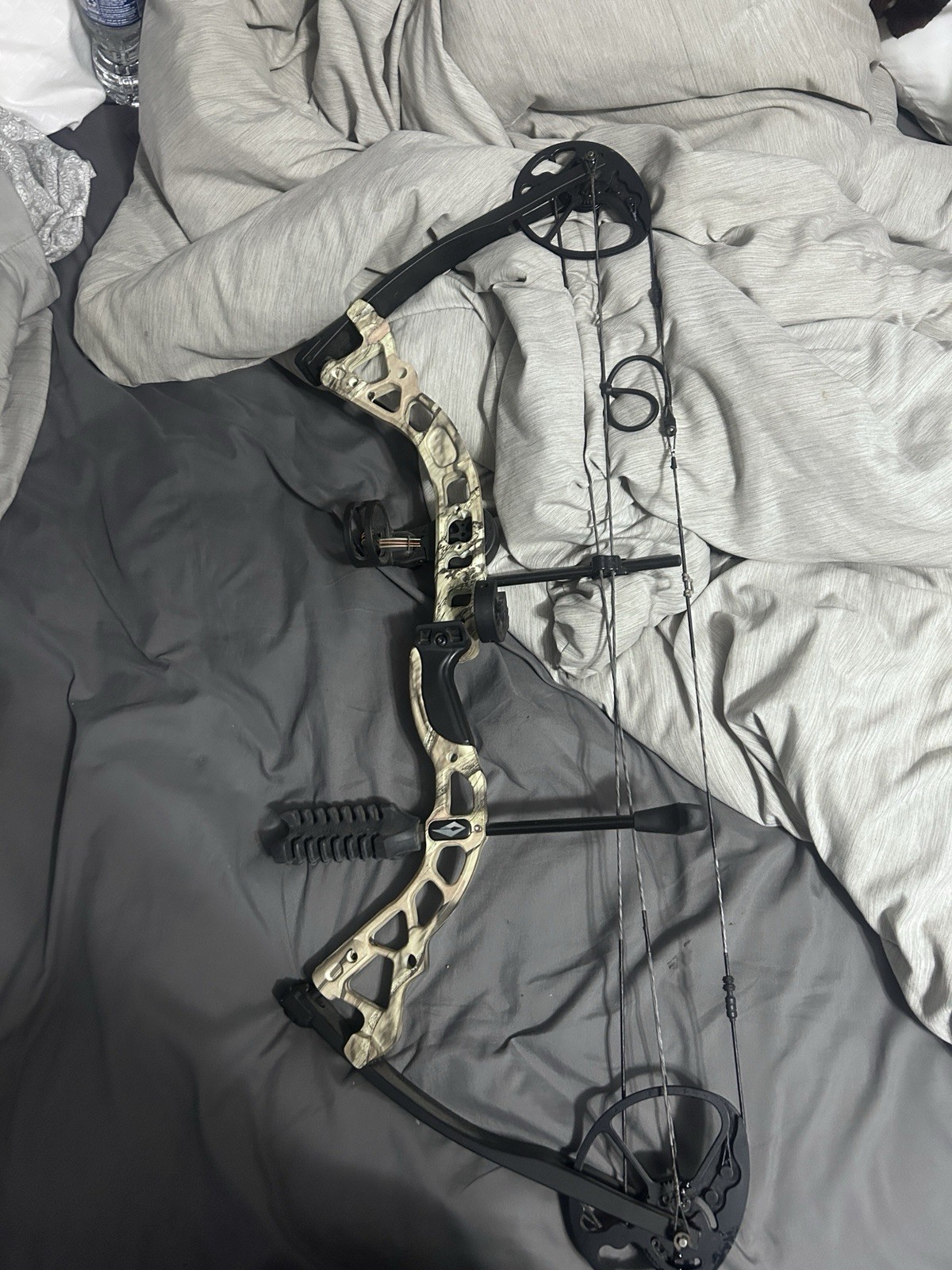 Dimond archery bow edge and climber stand with harness.