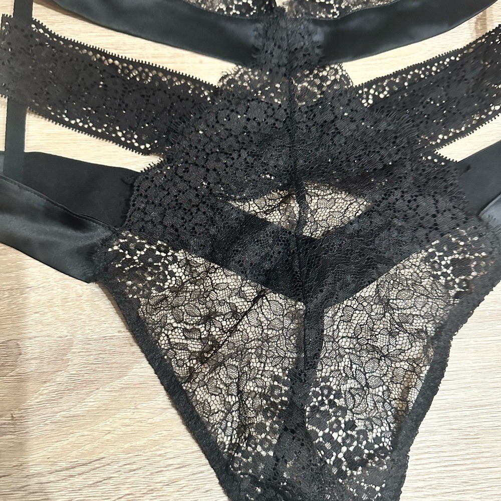 Victorias Secret Black Lace Thong Bodysuit. Size large.
