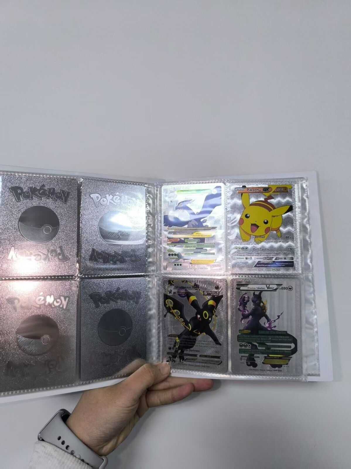 55 randomized Pokémon cards + booklet with 120 cards 4 cards per page New!