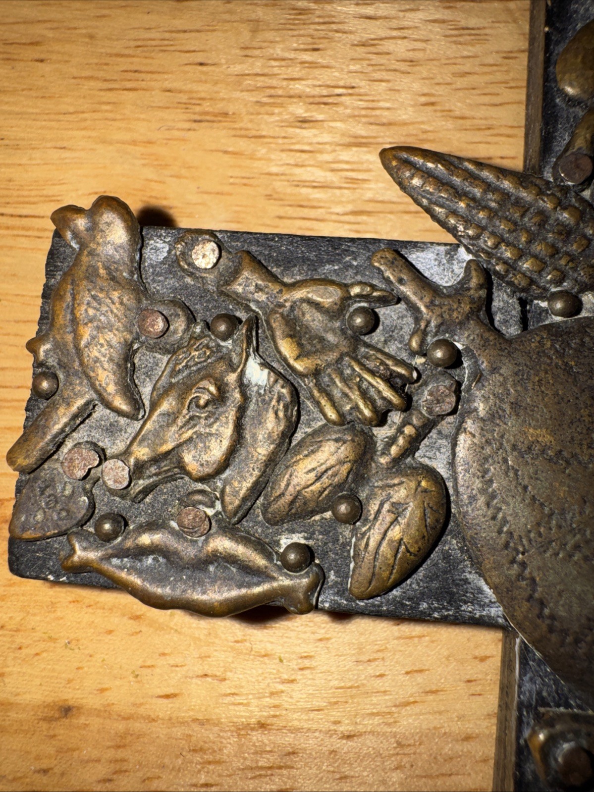 Vintage handmade folk art cross with 35+ brass milagros signed Gonzalez 1993