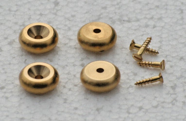 A  SET OF 4 STYLISH CAST BRASS BUN STYLE CLOCK FEET.