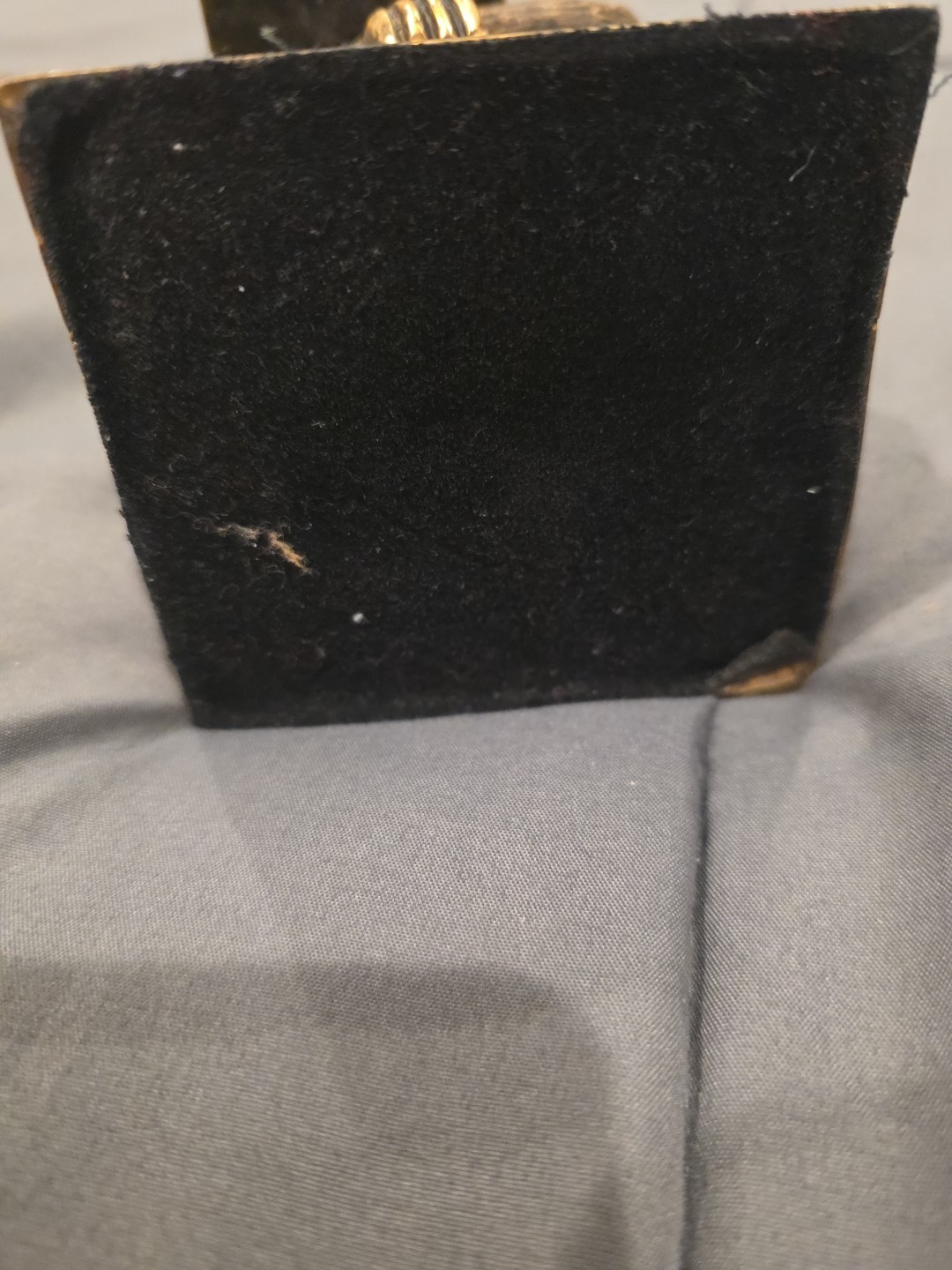 Bronze sculpture. Monkey with a book.