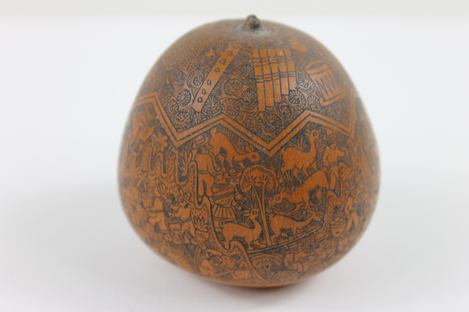 One exquisitely carved Peruvian storytelling gourd village life folk art