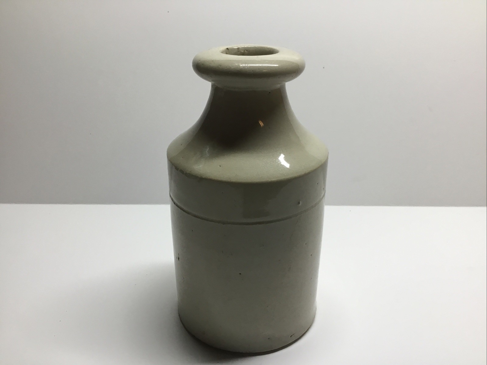 Antique Cream Colored Stoneware Polish Bottle. 4 5/8 Inches.