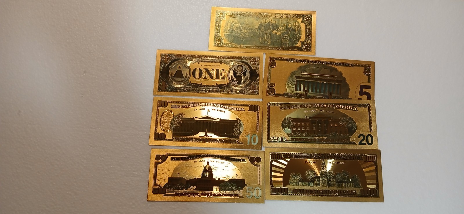 Lot of 80 novelty US coins and bills.