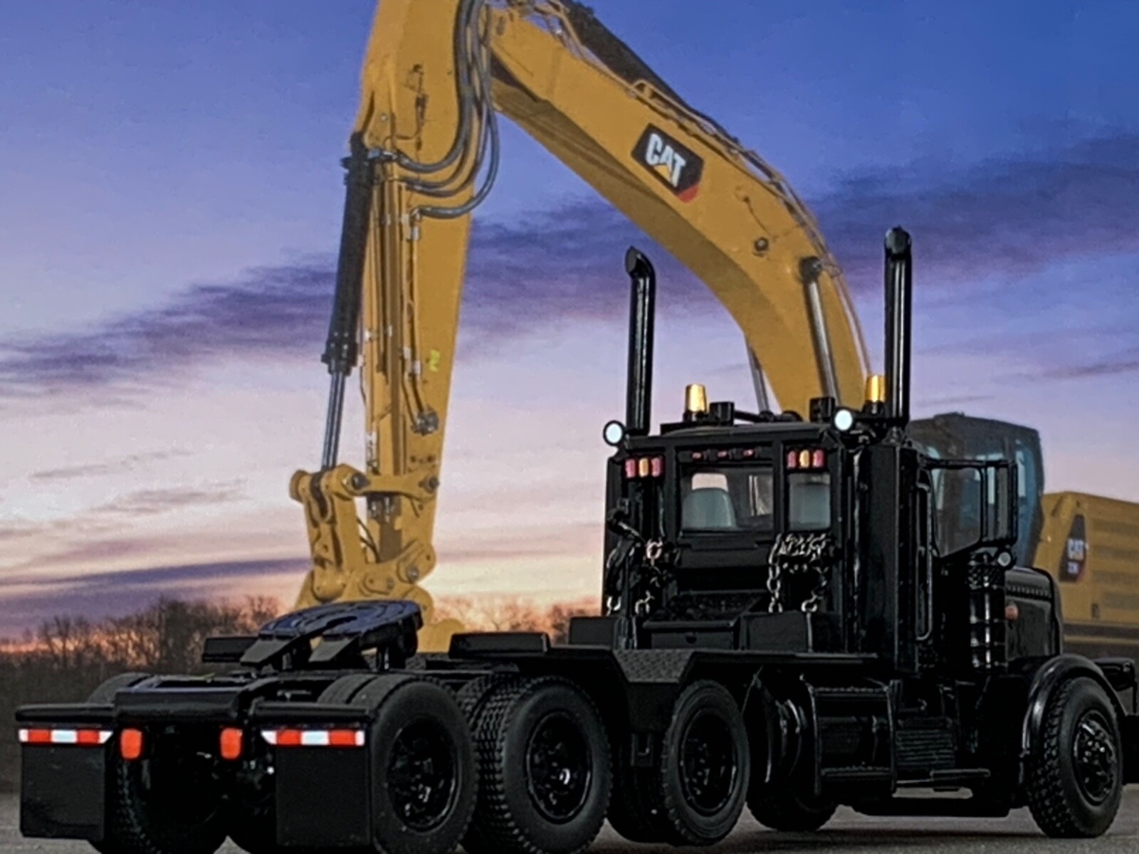 1/64 DCP ALL BLACK #2 PETERBILT 389 HEAVY HAUL TRI AXLE DAY CAB