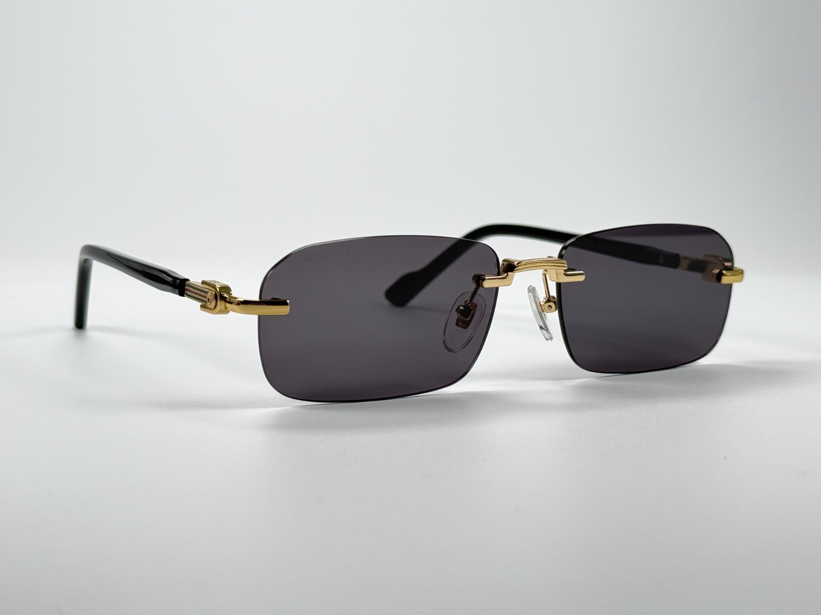 Gucci GG1221S 001 Black Gold Rimless Sunglasses Gray Lens 56mm