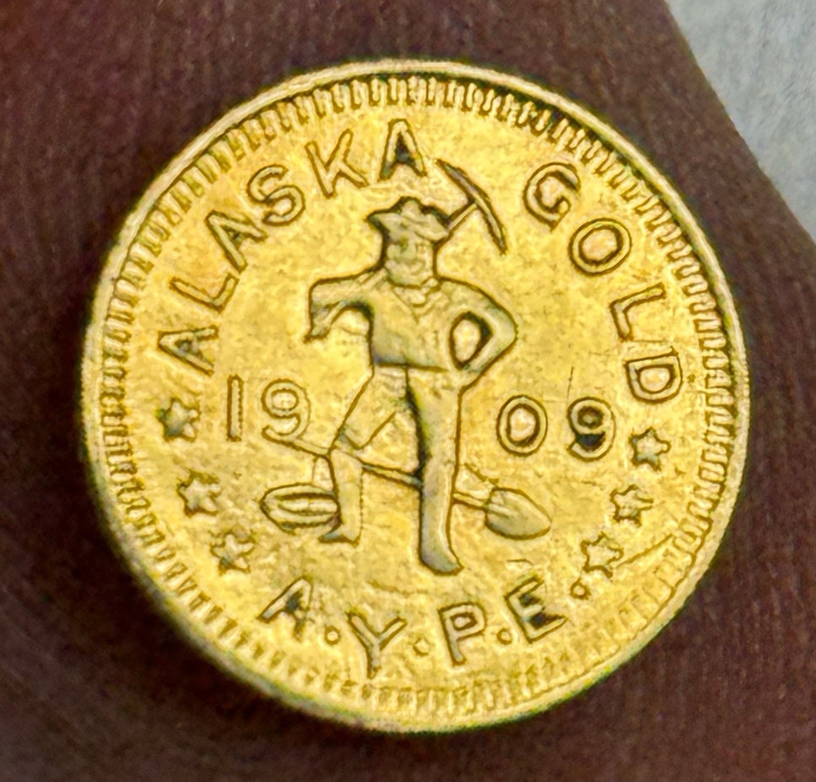 AU 1909 ALASKA YUKON Exposition 1/2 DWT (Dollar) Coin (0.79g; 0.025 Troy Oz)