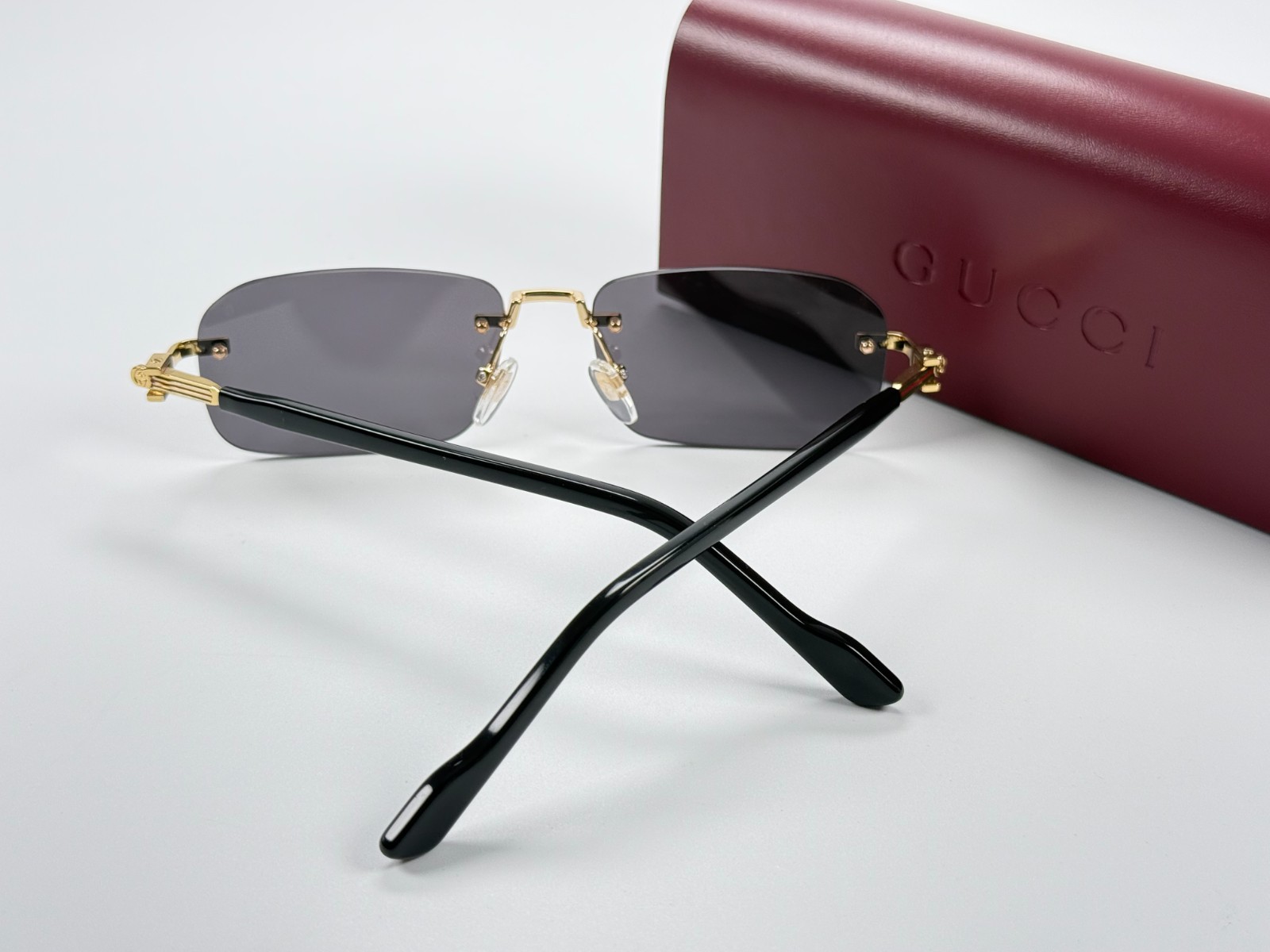 Gucci GG1221S 001 Black Gold Rimless Sunglasses Gray Lens 56mm